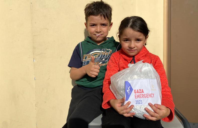 Children with aid parcel